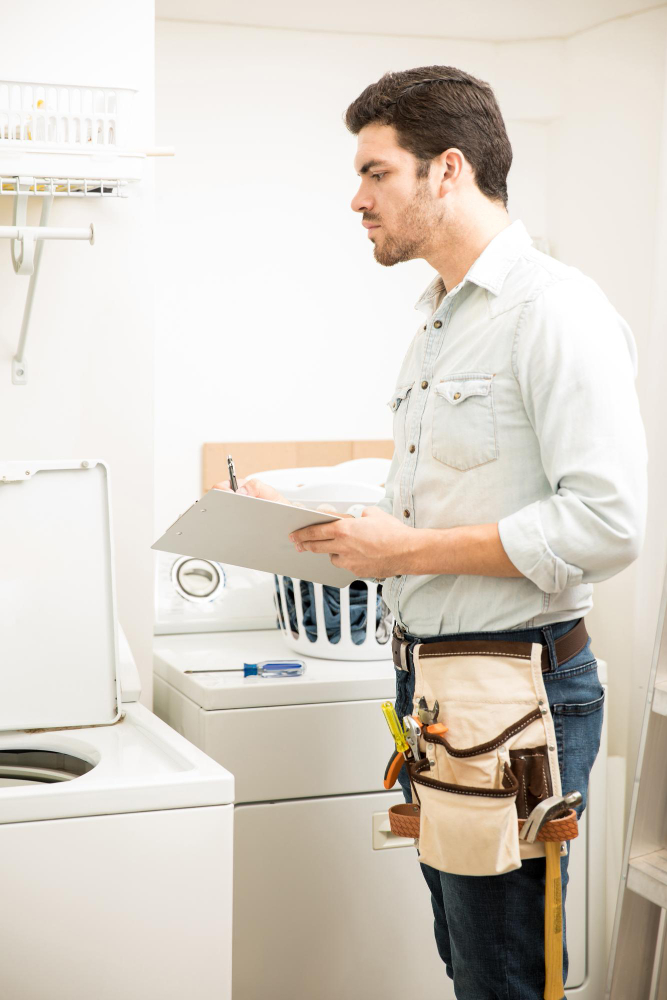 Technician inspecting a refrigerator